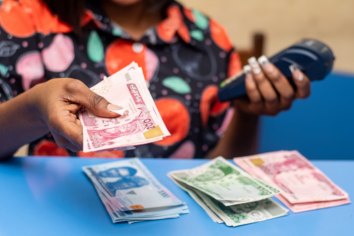 african-female-holding-the-nigerian-naira-banknote